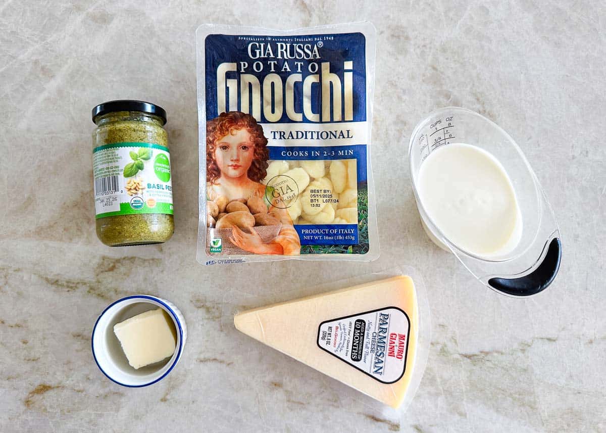 Pesto gnocchi ingredients on the counter.