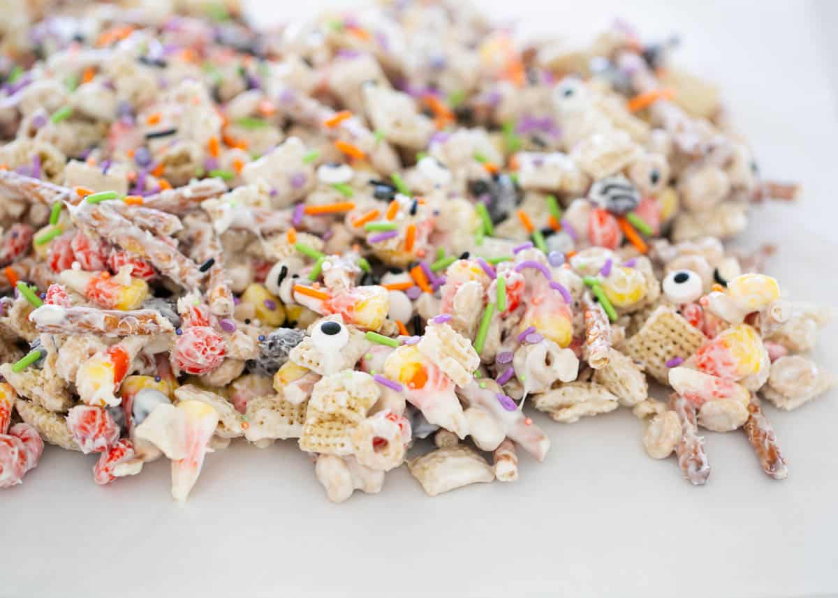 Halloween chex mix with sprinkles on top.