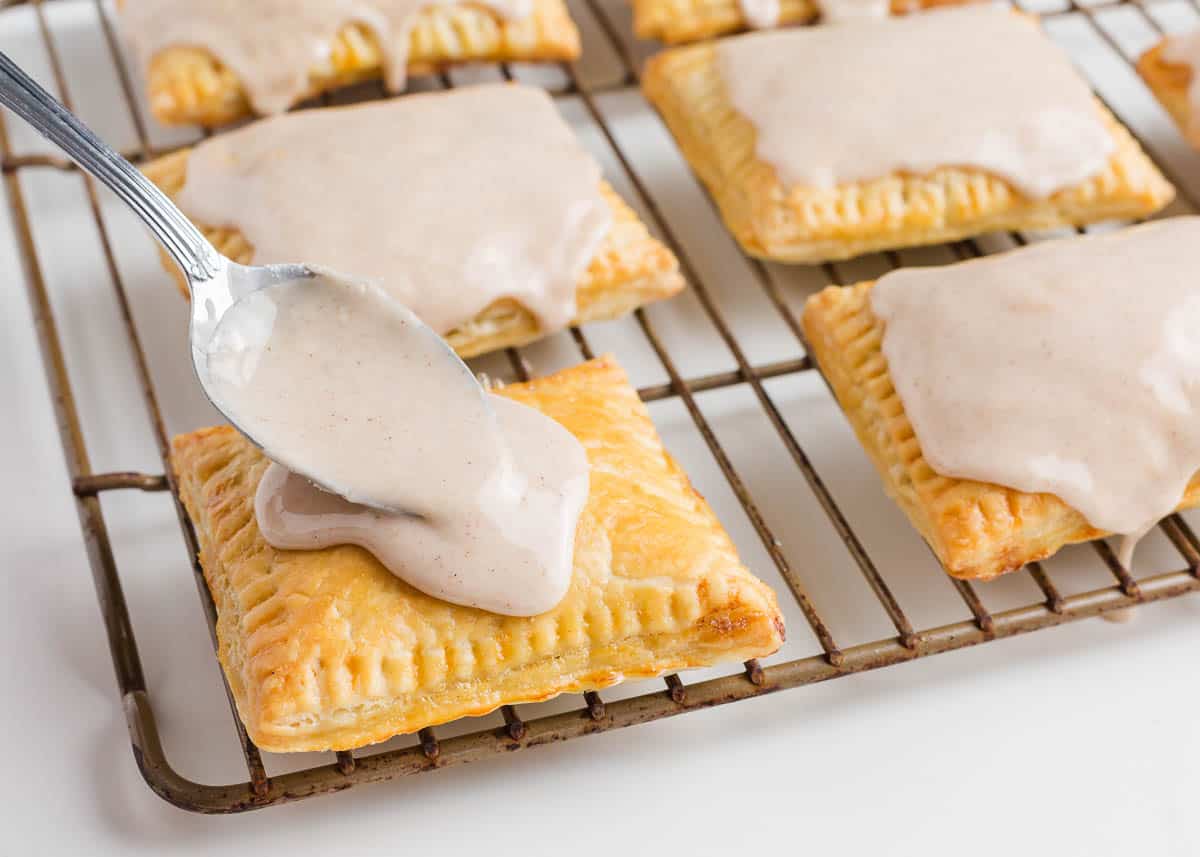 Pouring glaze over top of the pop tart.