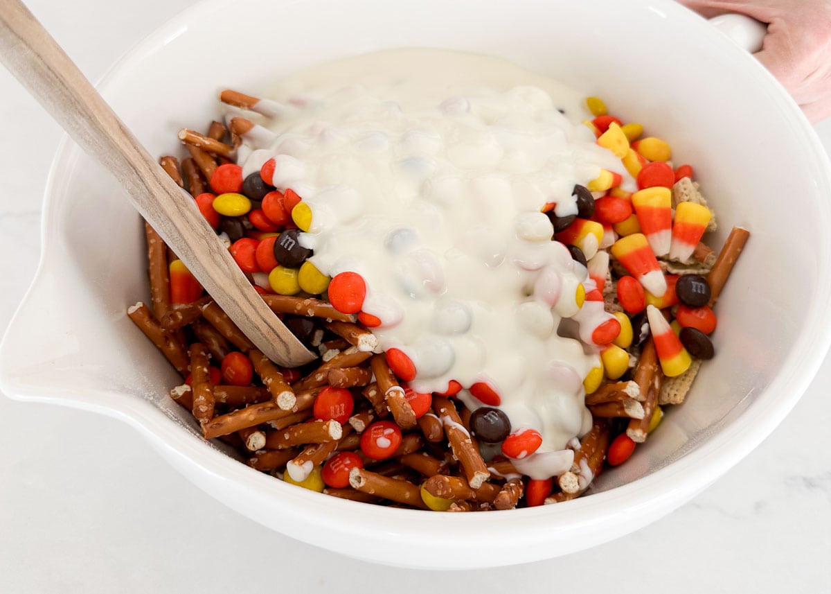 Showing how to make Halloween chex mix.