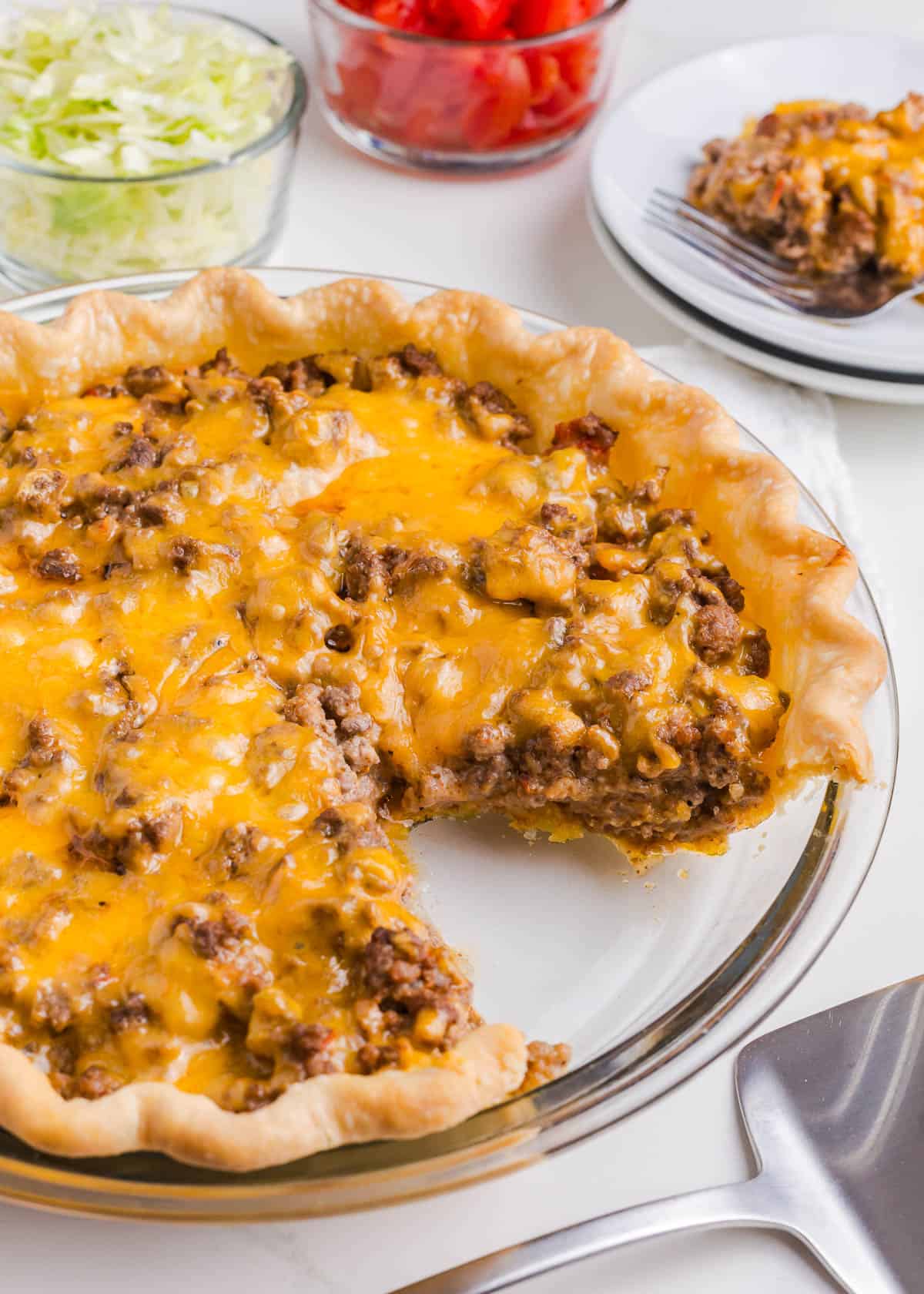 Taco pie in a glass dish.