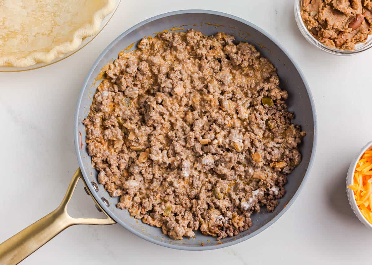 Cooking ground beef in a pan.