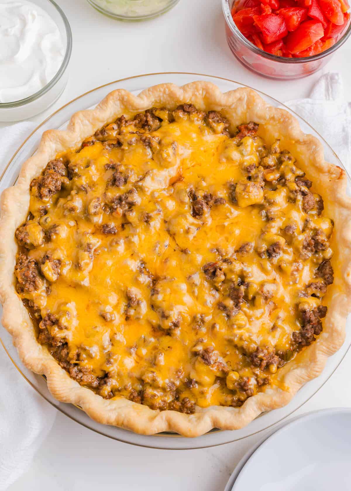 Taco pie cooked in a pie dish.