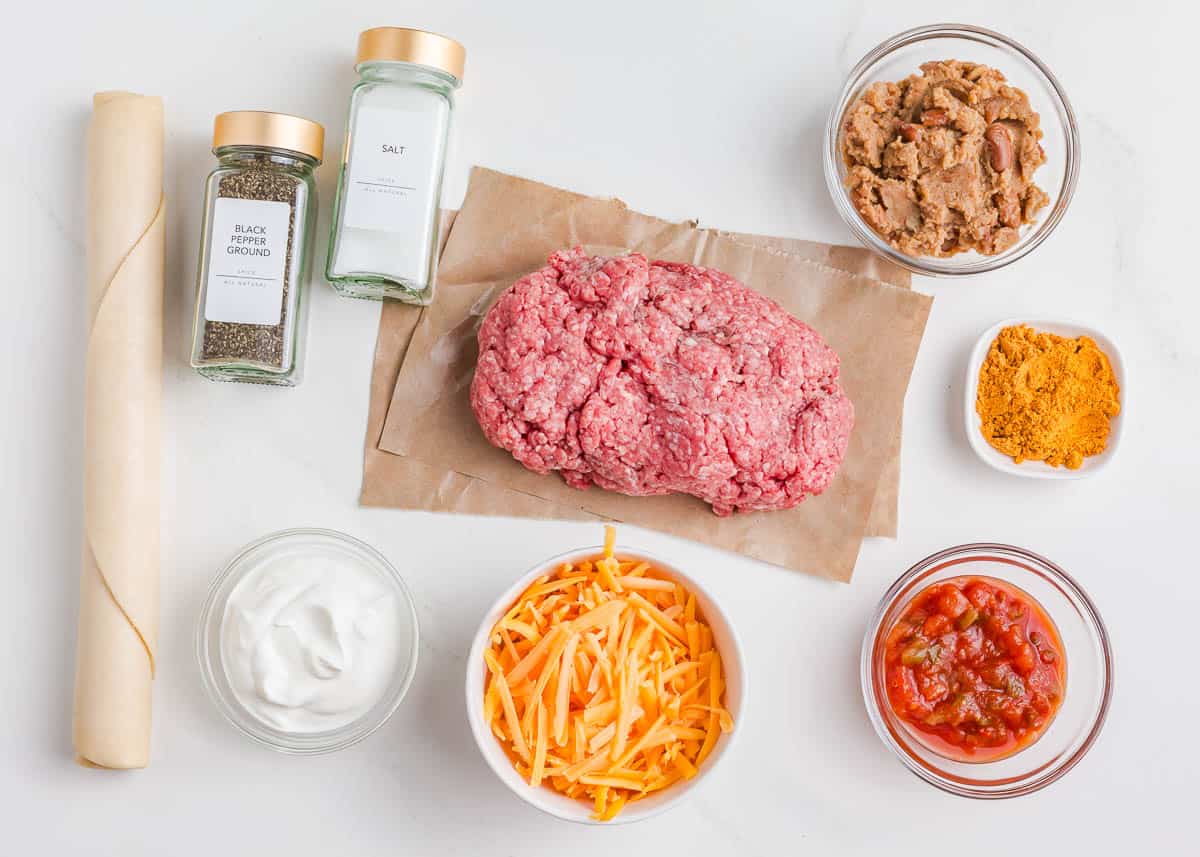 Taco pie ingredients on the counter.