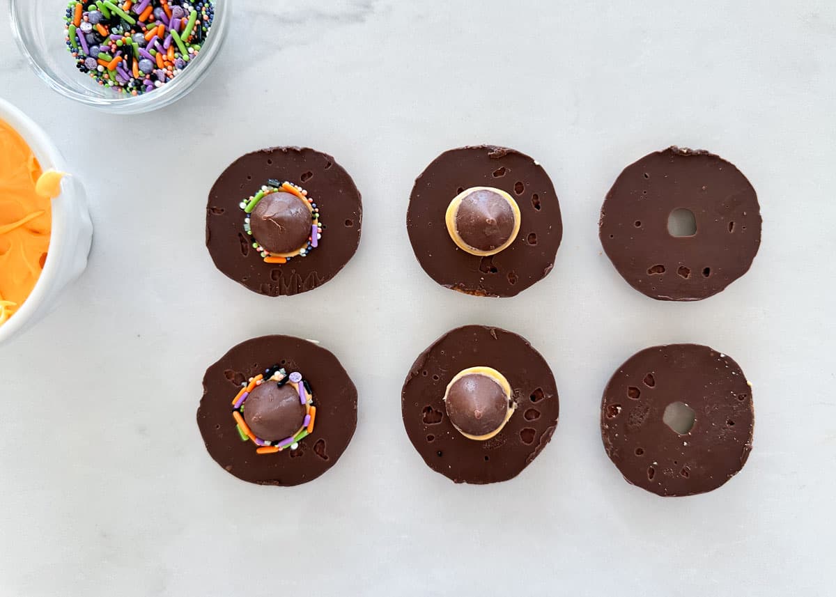 Showing how to make witch hat cookies.