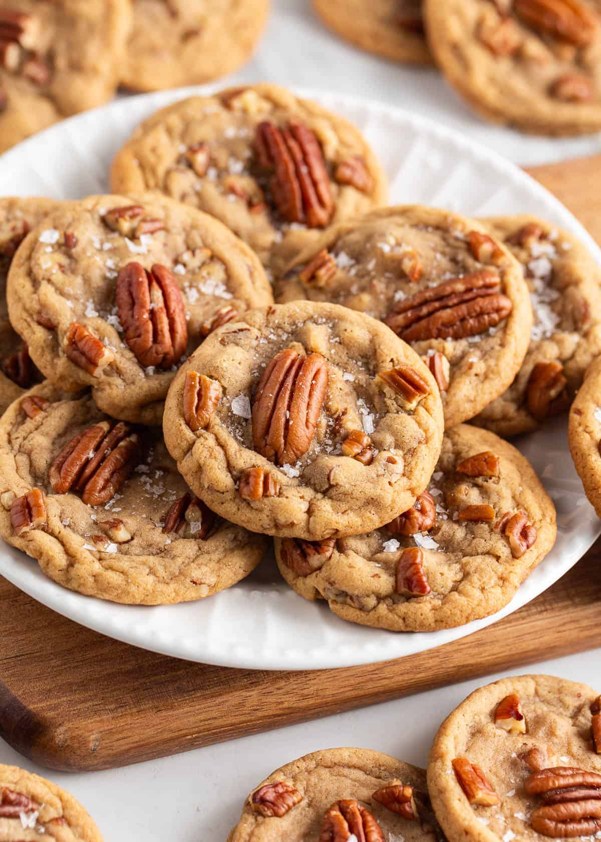 Butter pecan cookies on on a white plate.