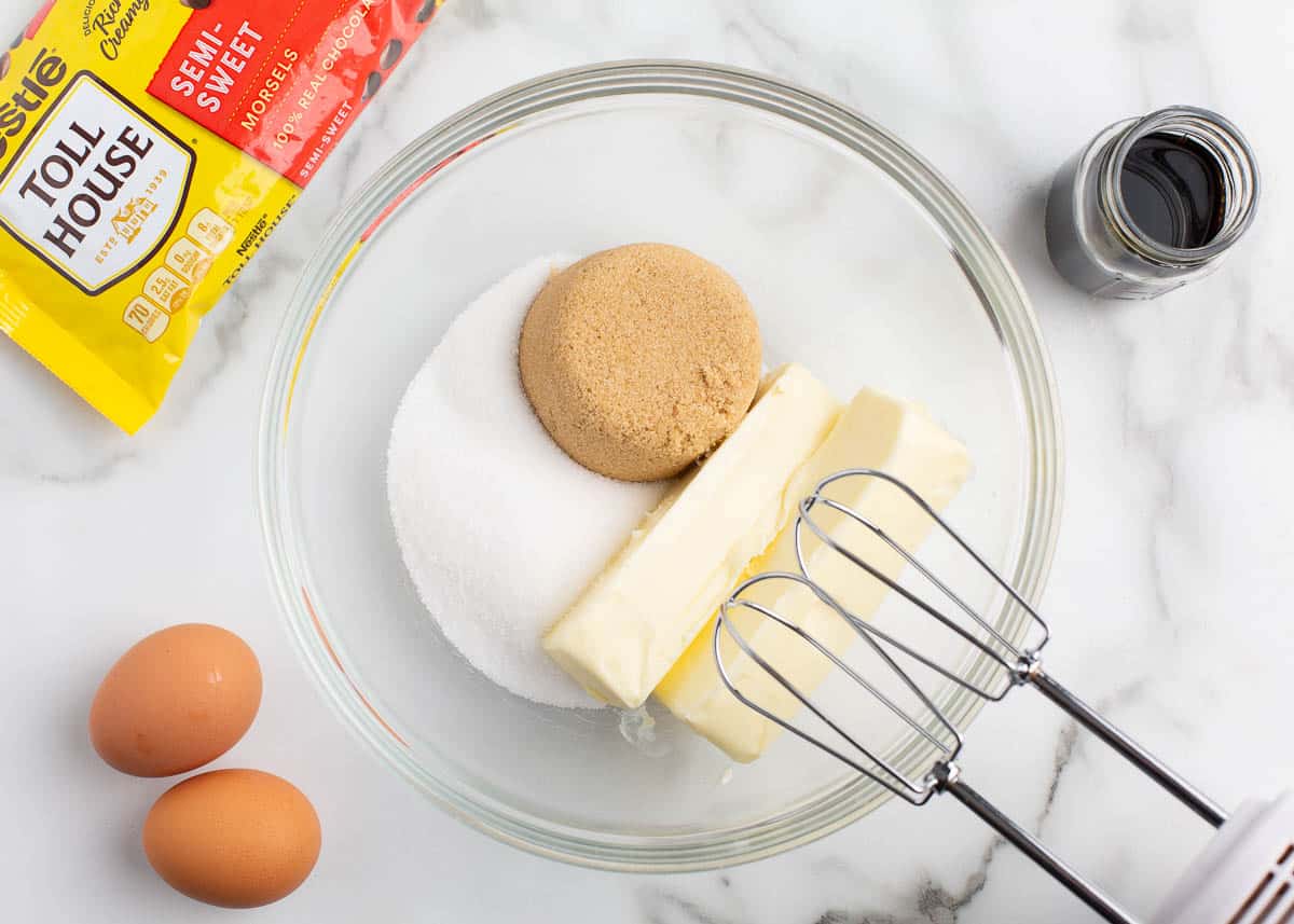 Mixing butter and sugar in a bowl.