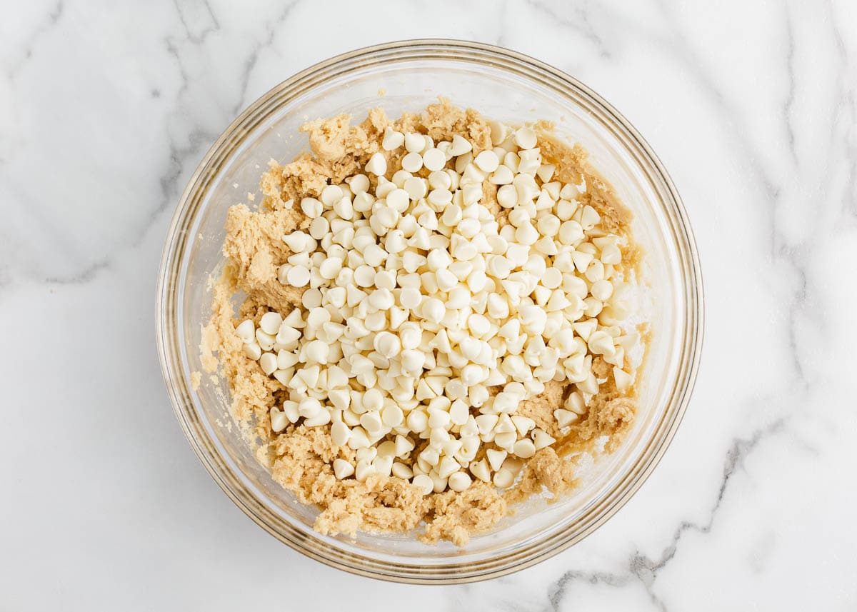 Showing how to make white chocolate chip cookies.