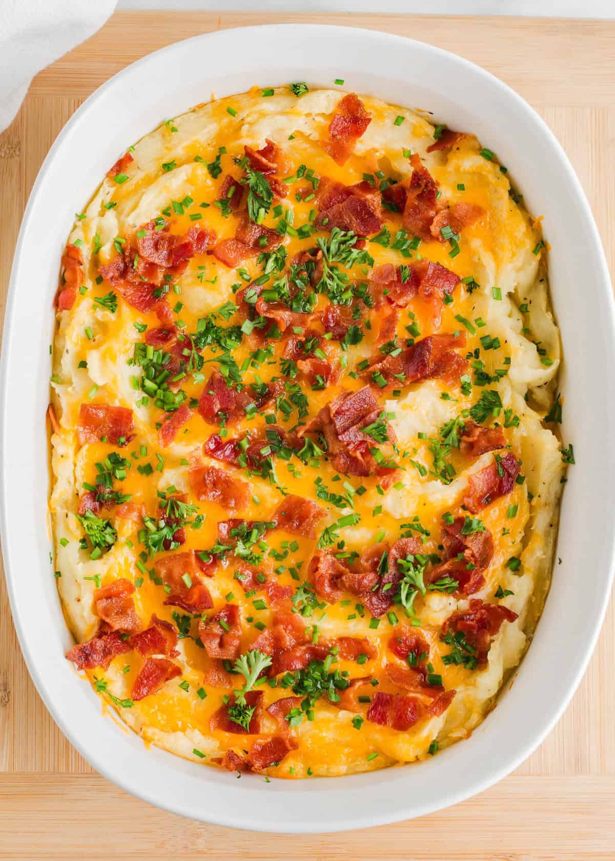 Mashed potato casserole with cheese and bacon.