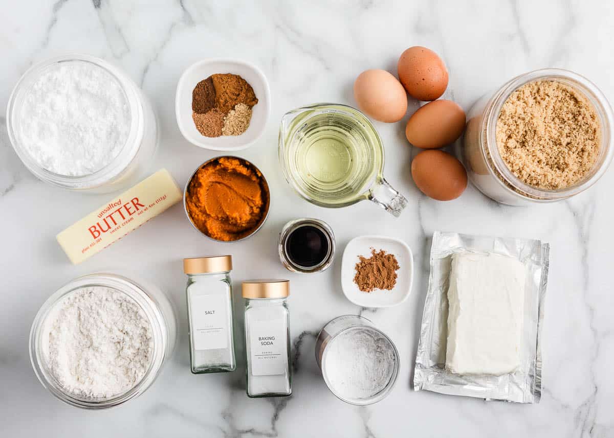 Pumpkin cake ingredients on counter.