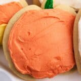 Pumpkin cut-out cookies on cake plate.