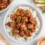 Sesame chicken and rice in a bowl.