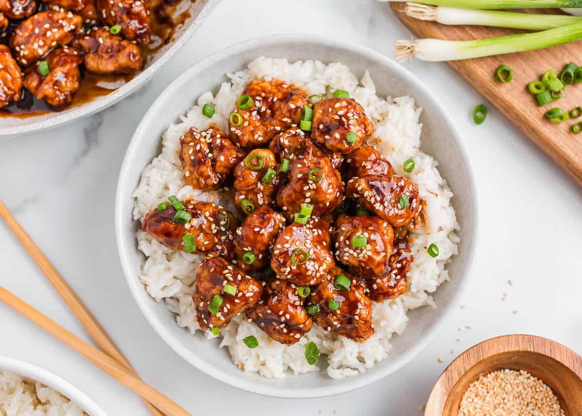 Sesame chicken and rice in a bowl.