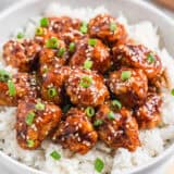 Sesame chicken and rice in a bowl.