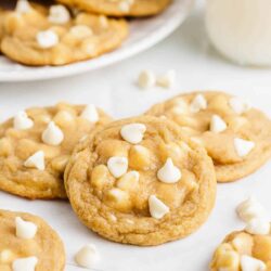 Stacked white chocolate chip cookies.