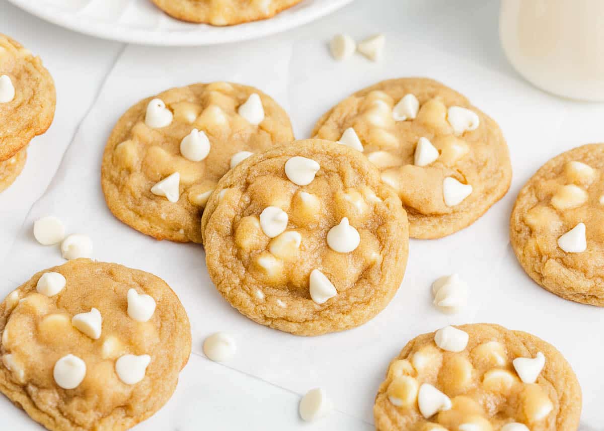 Stack of white chocolate chip cookies.