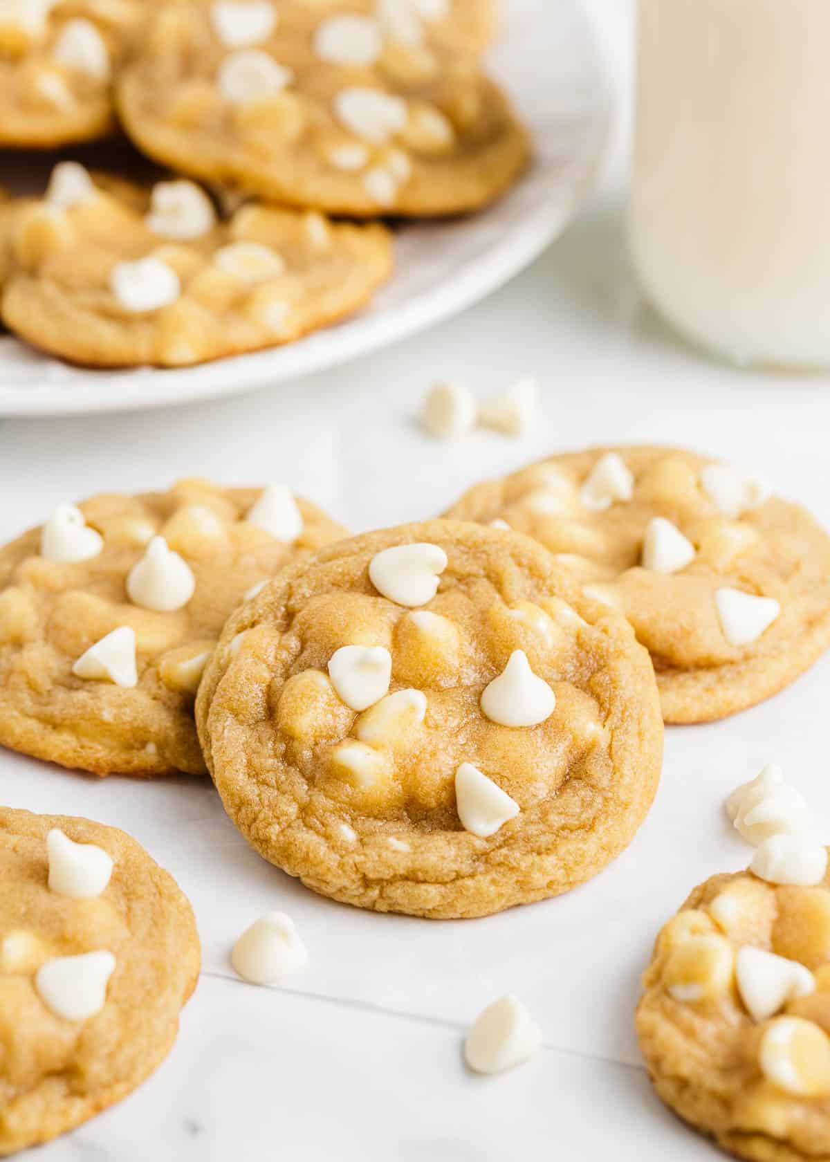 Stacked white chocolate chip cookies.