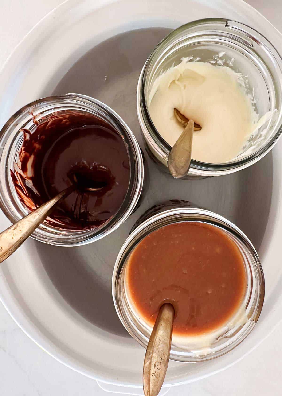 Caramel sauce and chocolate jars.