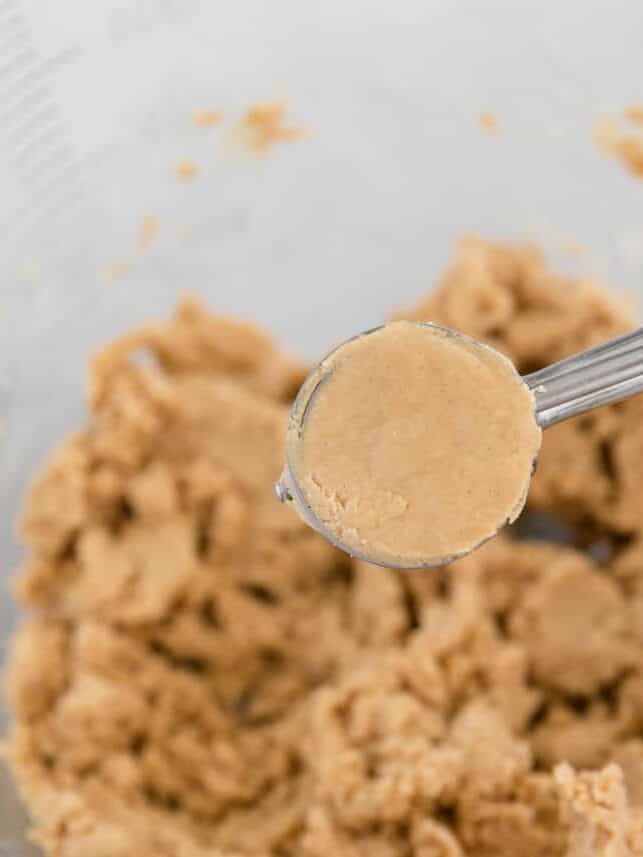 Smooth peanut butter mixture in a cookie scoop.