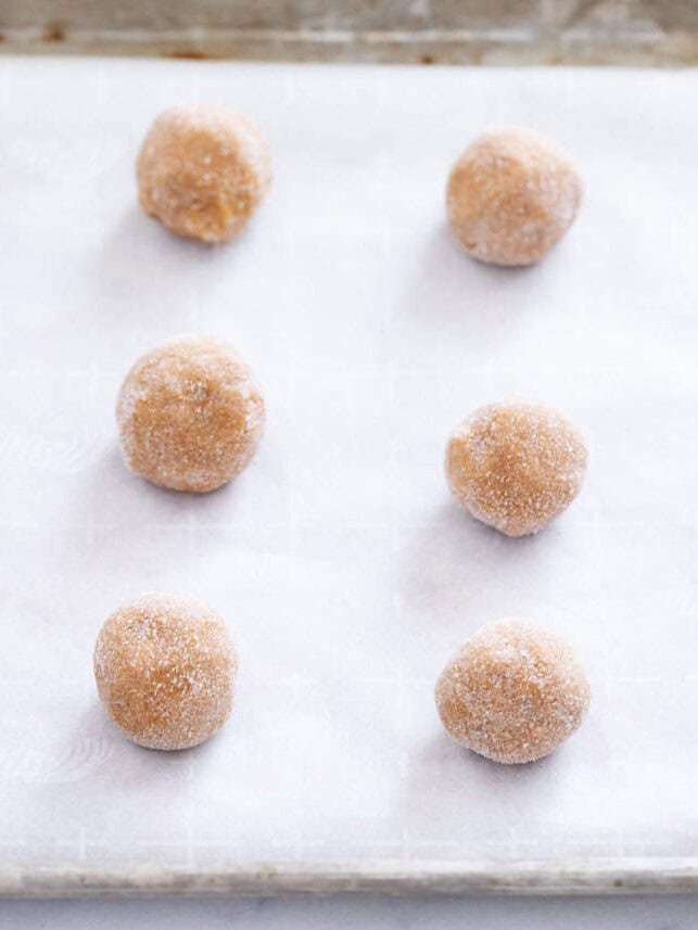 Ginger molasses cookie balls rolled in sugar.