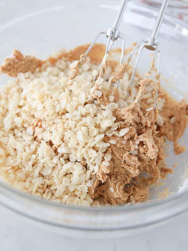 Peanut butter mixture in a ball with rice krispies.