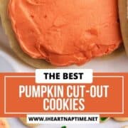 Frosting pumpkin cut-out cookies.