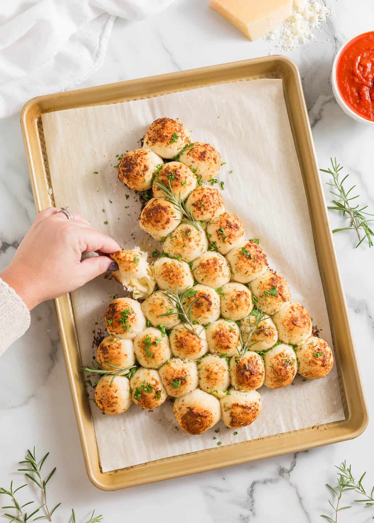 Christmas tree pull apart bread on a baking sheet.