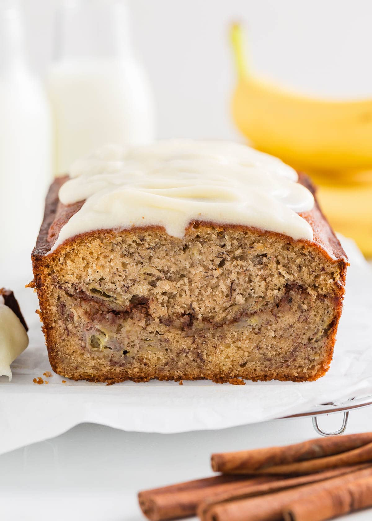 Cinnamon roll banana bread with cream cheese frosting.