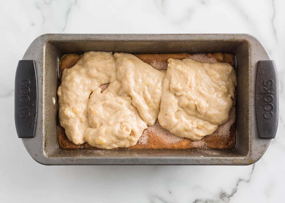 Cinnamon roll banana bread in a loaf pan.