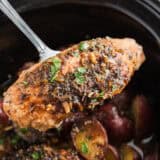 Crockpot chicken and potatoes in slow cooker.