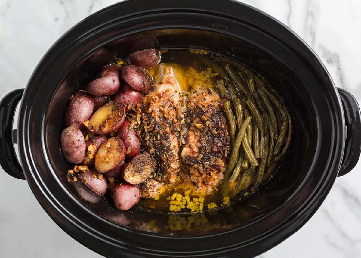 Showing how to make crockpot chicken and potatoes. 