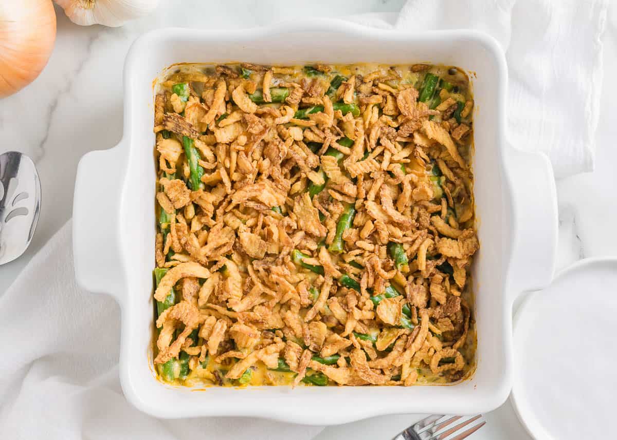 Showing how to make a green bean casserole.