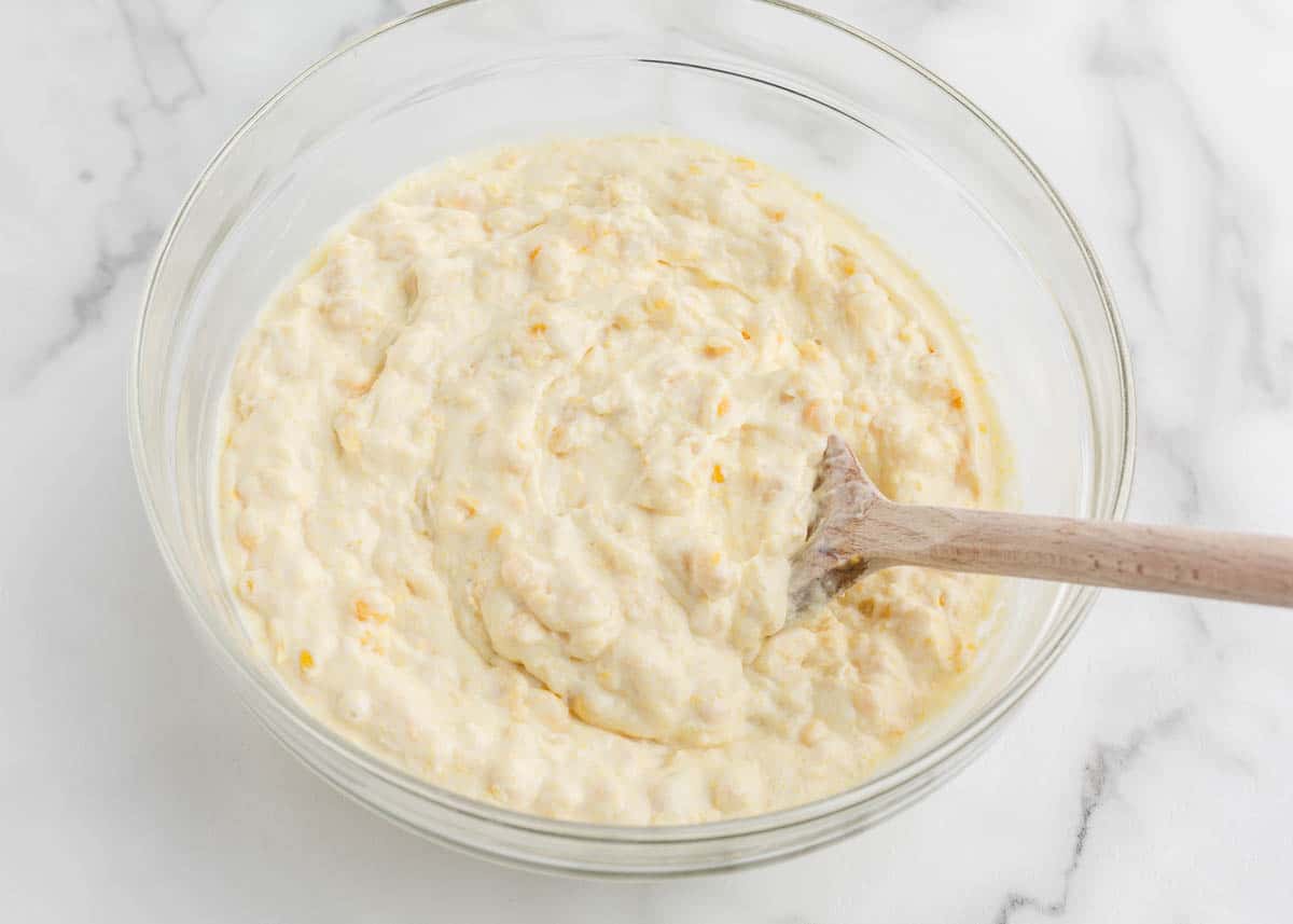 Showing how to make jiffy corn pudding.