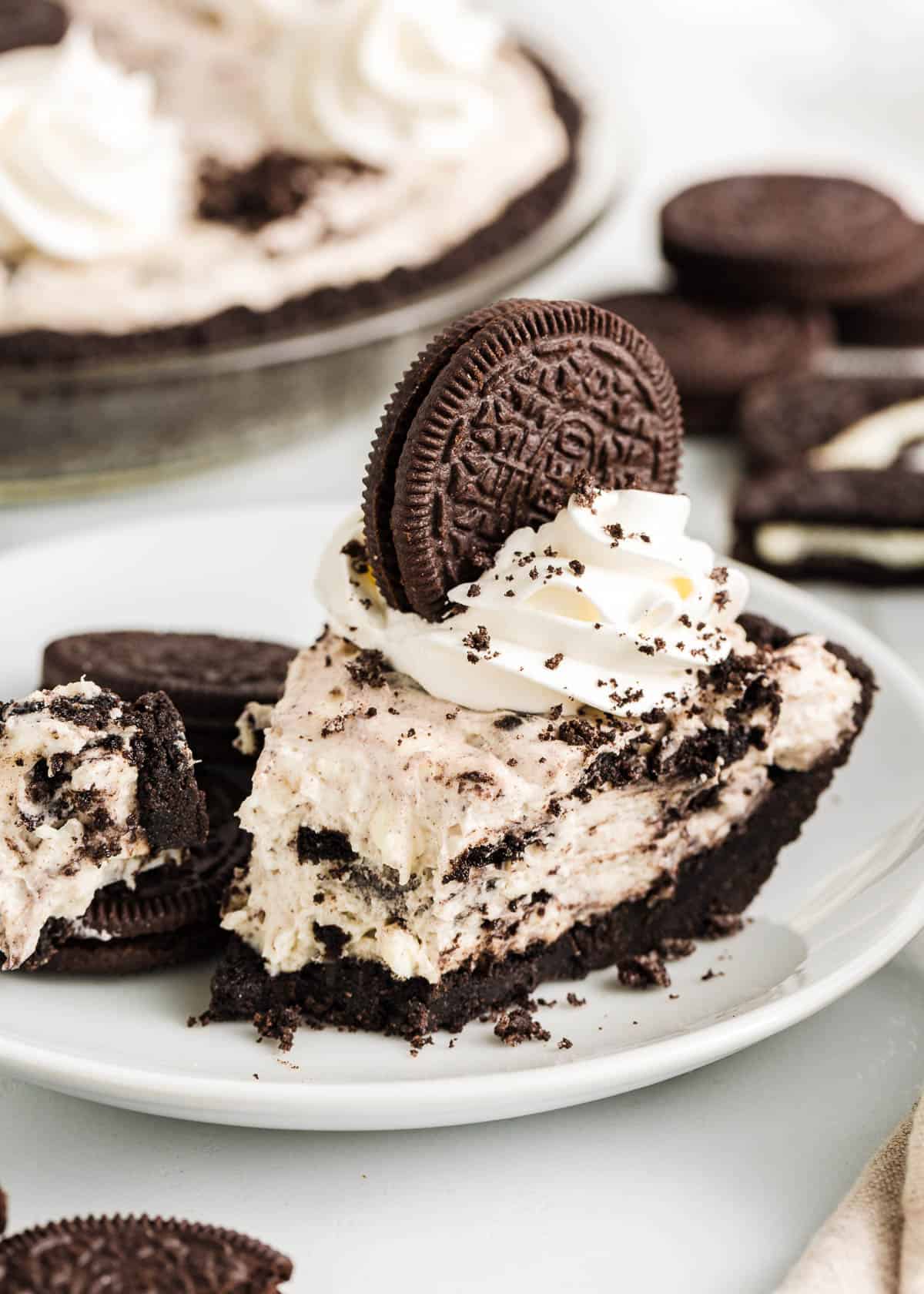 Slice of oreo pie on a plate.