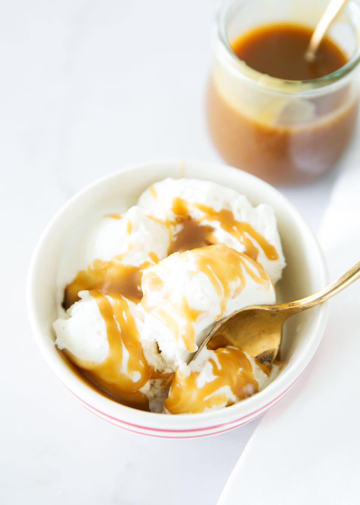 Butterscotch and ice cream in a bowl.