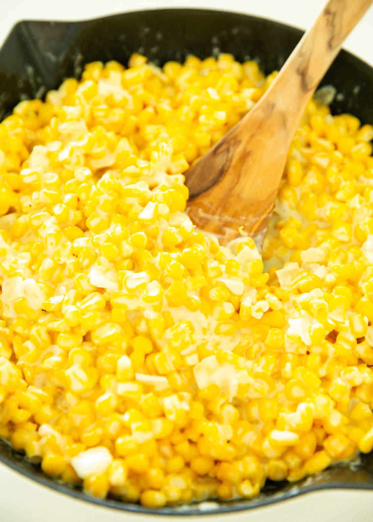 Creamed corn in a skillet.