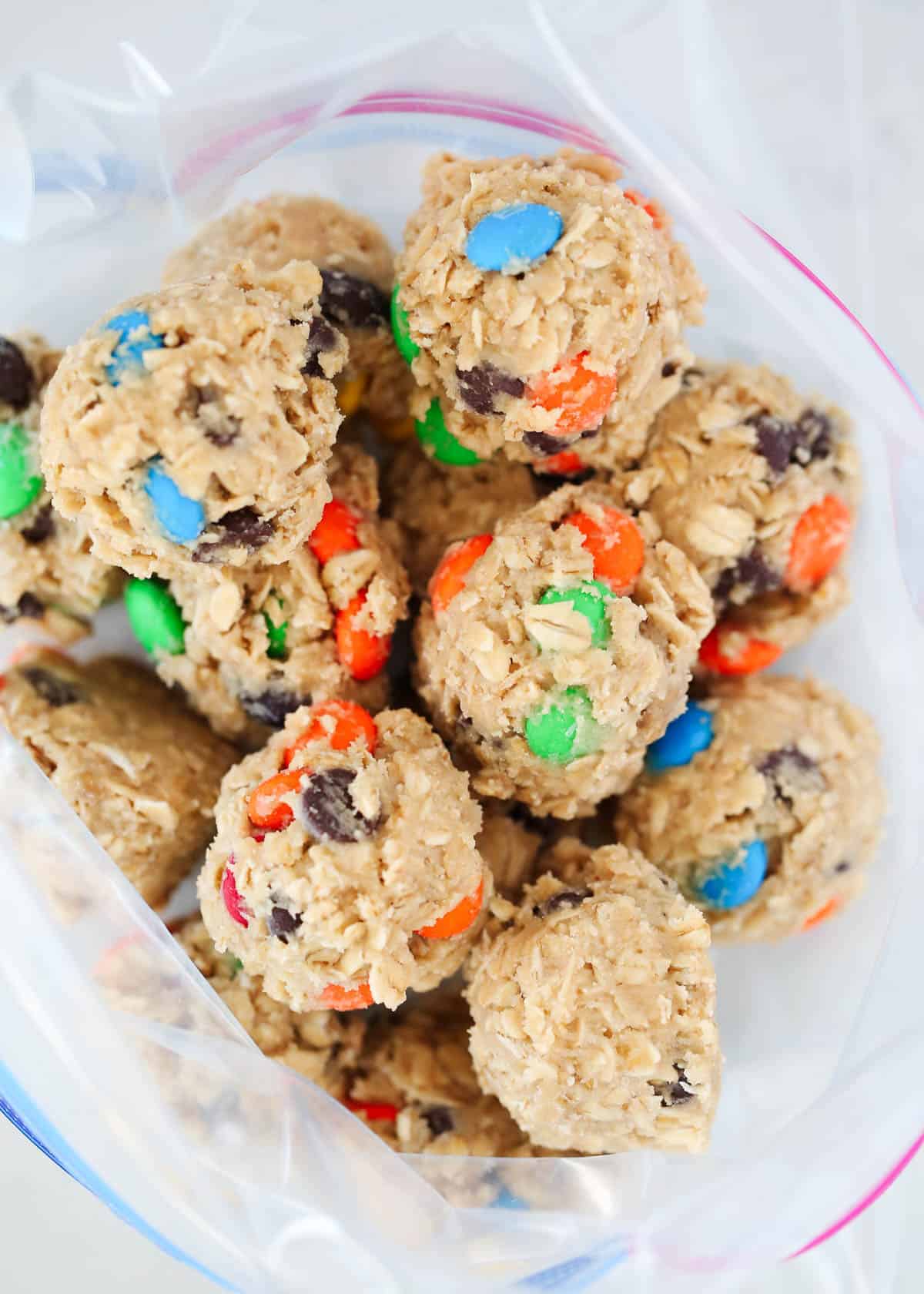 Frozen cookie dough balls in a freezer bag.