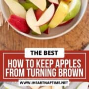 Apples treated with saltwater in a bowl and laid out on a baking sheet.