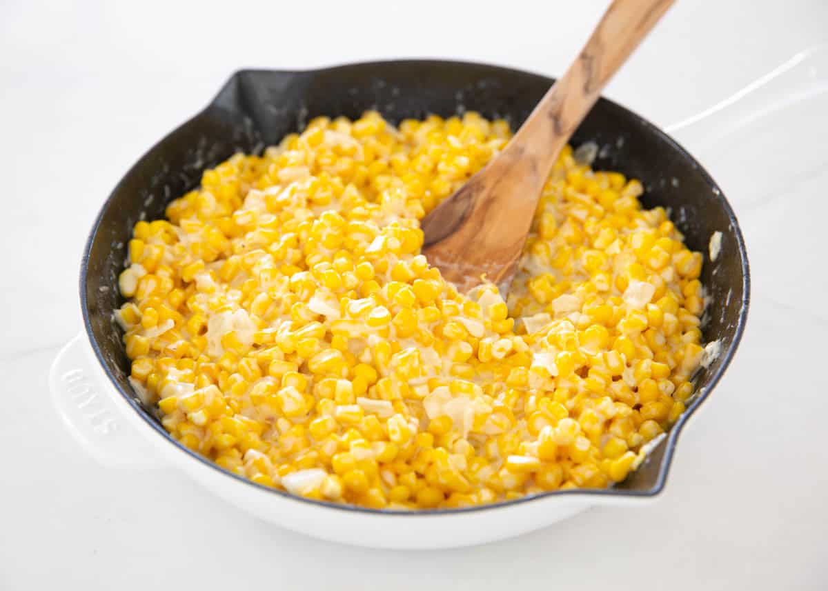 Creamed corn in a skillet.