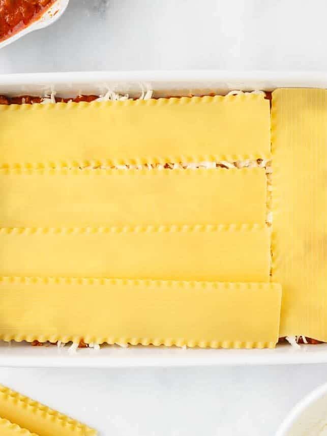 Showing lasagna layers in a baking dish.