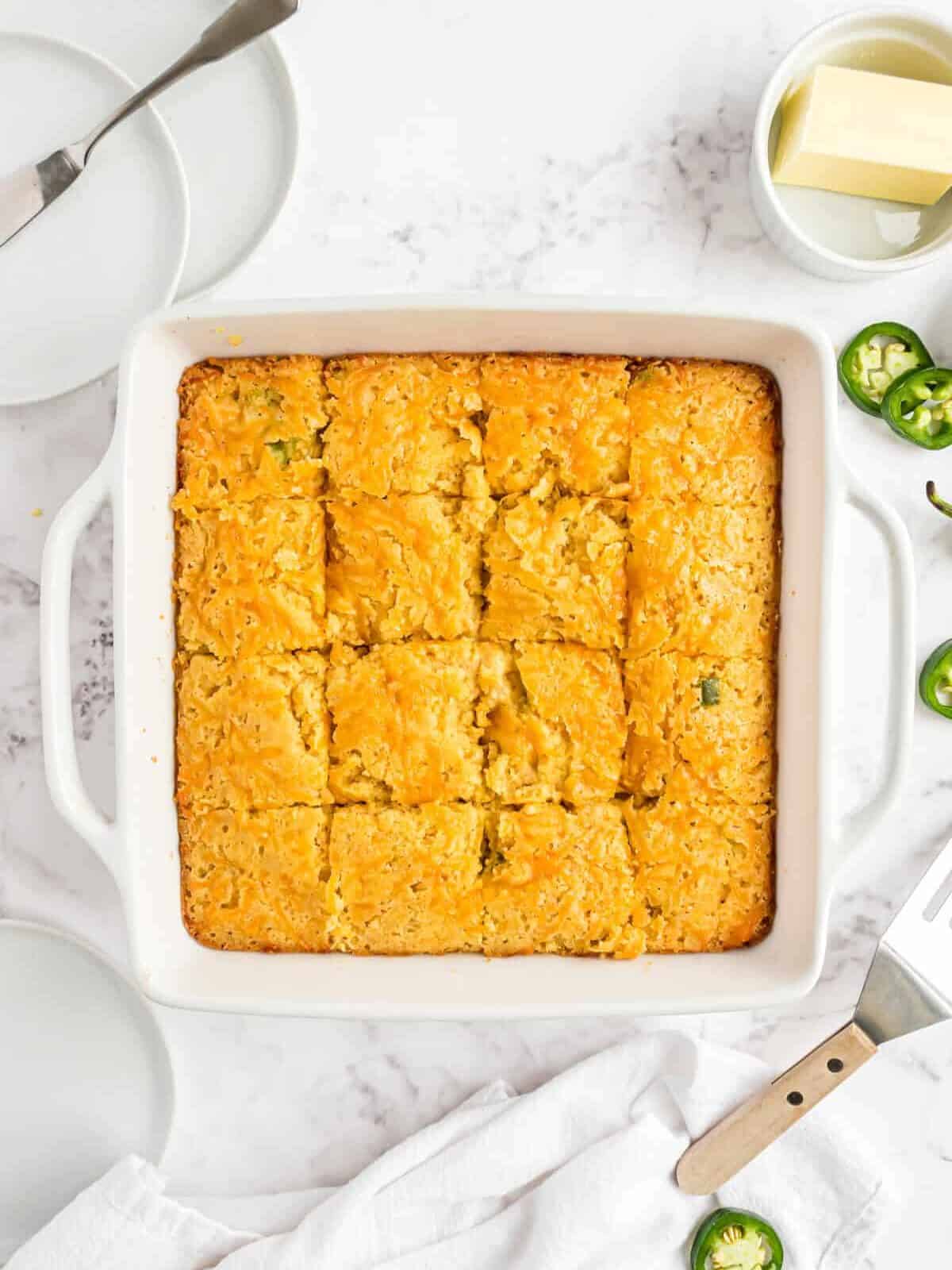 A pan of Mexican cornbread cut into slices.