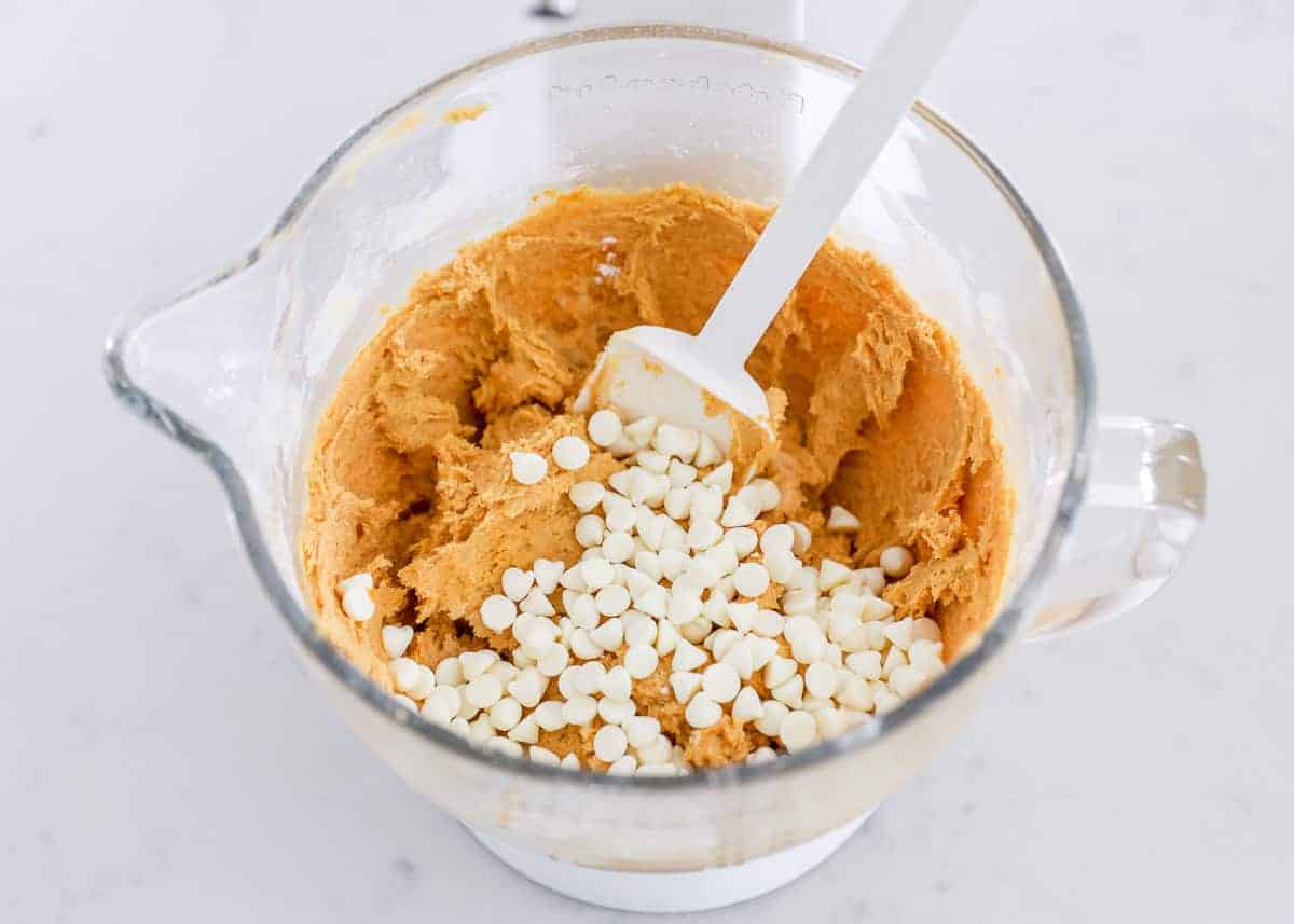 Pumpkin snickerdoodle batter with white chocolate chips.