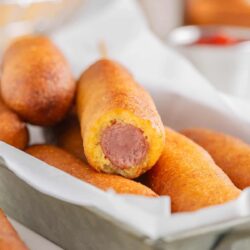 Corn dog with a bite taken.