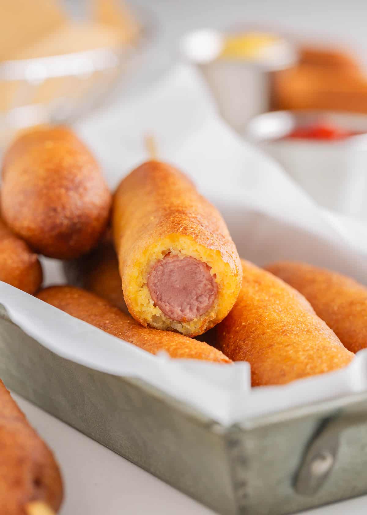 Corn dog with a bite taken.