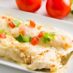 White chicken enchiladas on a plate.