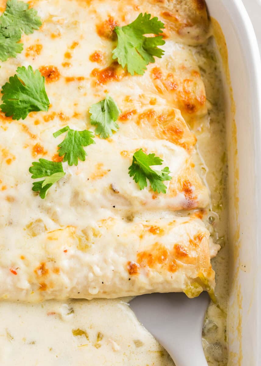 A pan of white chicken enchiladas.