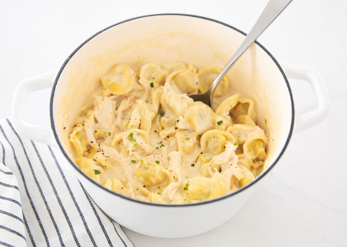 Chicken tortellini alfredo in a pot.