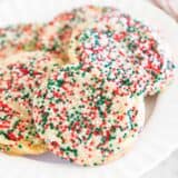 Drop sugar cookies on a white plate.