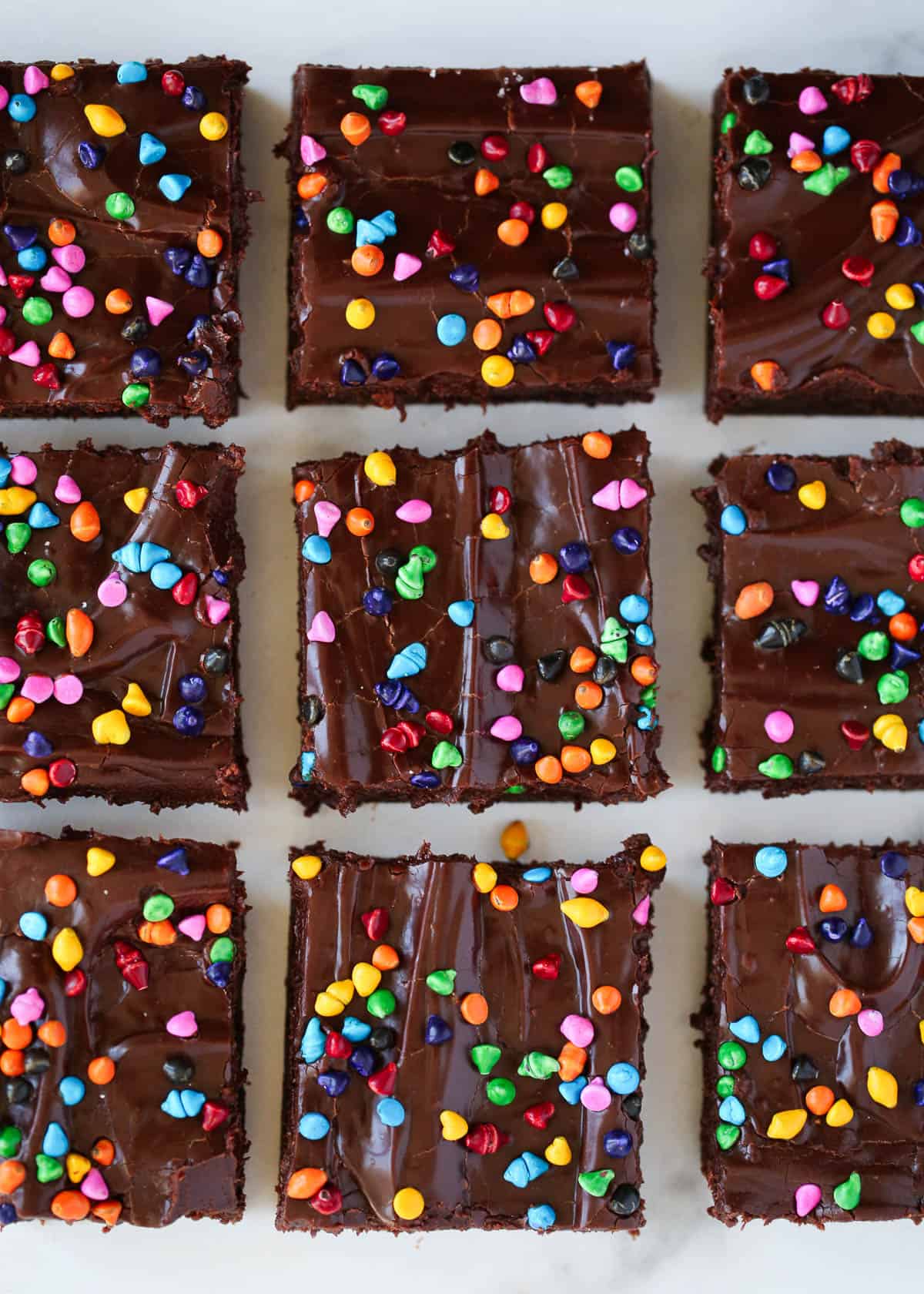 Three rows of sliced homemade cosmic brownies.