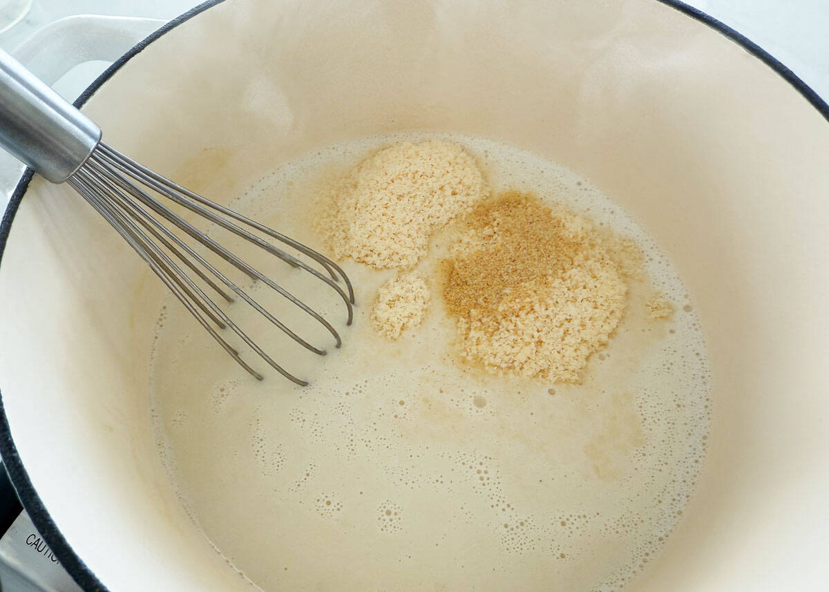 Showing how to make chicken tortellini alfredo in a bowl.